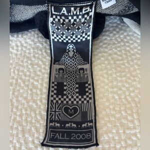 Fall 2008 L.A.M.B. Black and White Wool Poncho with Pom Pom tie.